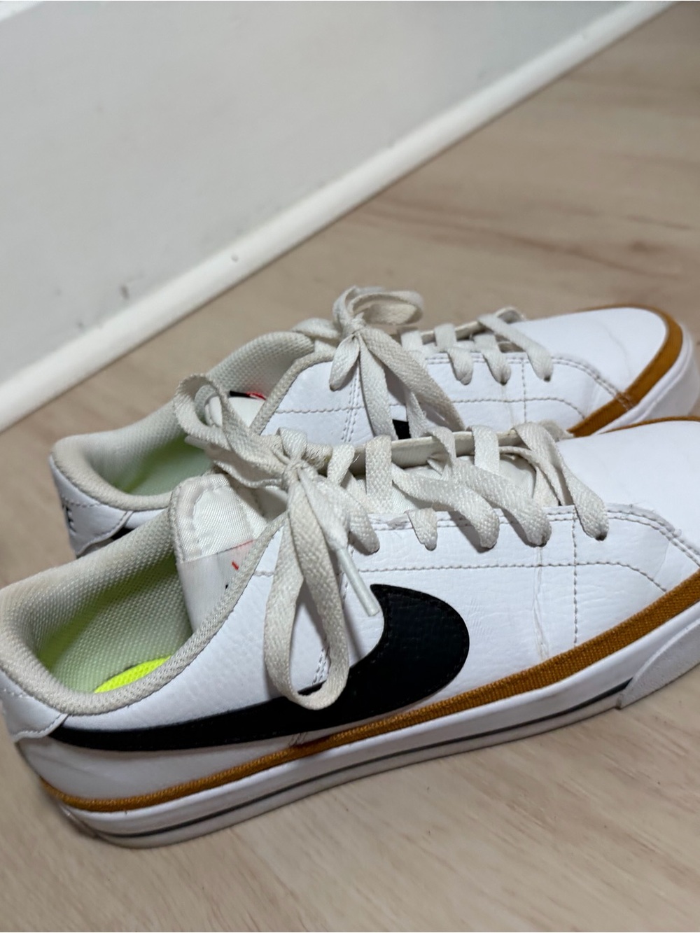 Nike Women White Sneakers with Black Swoosh and Brown Trim